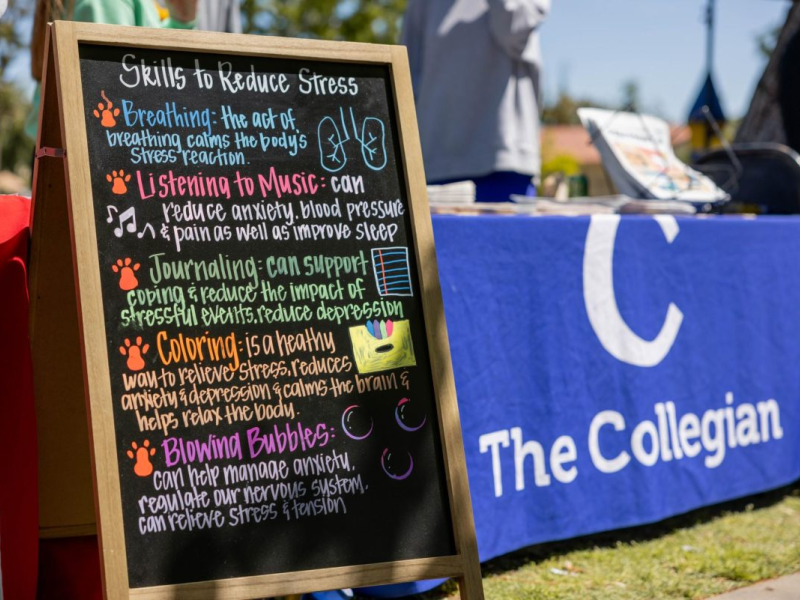 A sign at a campus event describes ways to reduce stress. Photo by Jacqueline Carrillo/The Collegian.