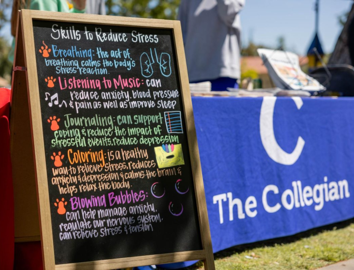 A sign at a campus event describes ways to reduce stress. Photo by Jacqueline Carrillo/The Collegian.