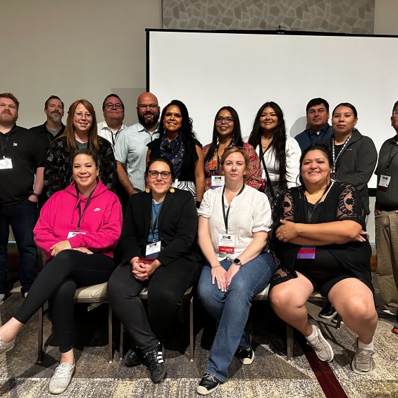 The Health Equity cohort poses for a photo at a conference