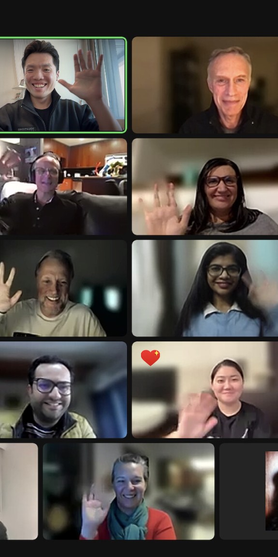 Participants in a virtual training smile and wave at each other