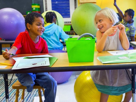 two young students in a classroom