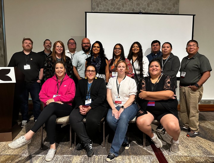 The Health Equity cohort poses for a photo at a conference