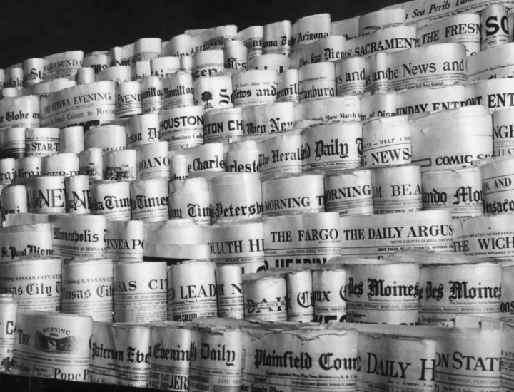 Newspapers are rolled and displayed