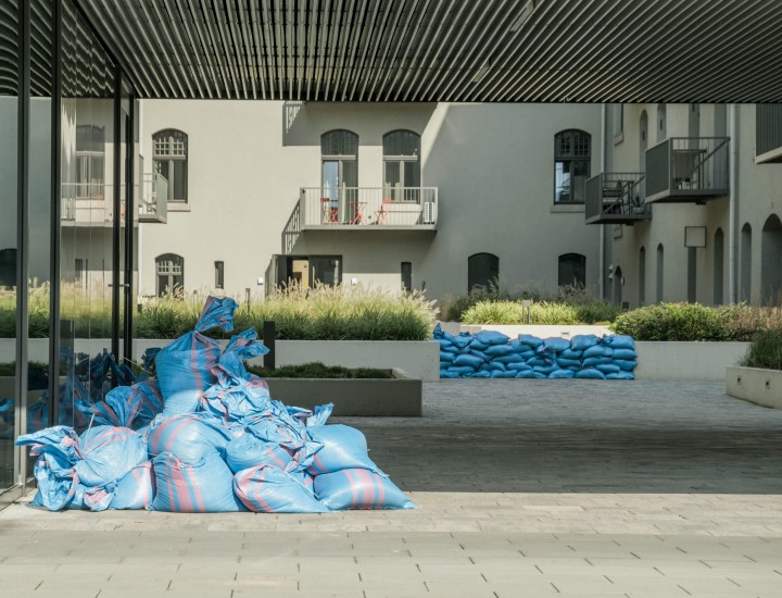 Sandbags are stacked outside an apartment building